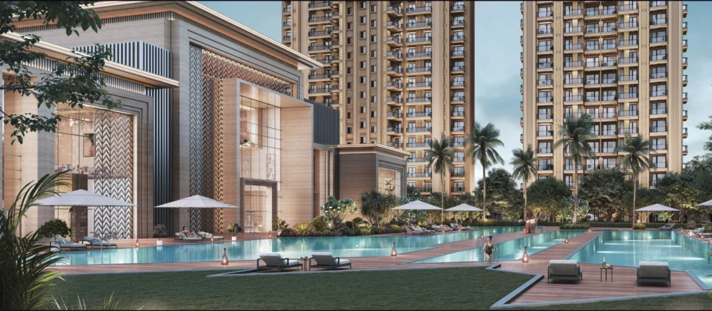 Luxurious apartment complex with a large pool, sun loungers, umbrellas, and palm trees surrounding beige high-rise towers.